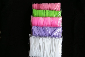 Five assorted colors of plastic facial mask spatulas in clear individual polybags