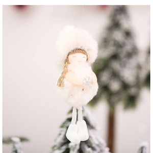 Detail of plush Christmas angel ornament with silver snowflake and golden braids