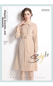 Close-up of beige shirt dress featuring woven texture panel and metallic buckle belt