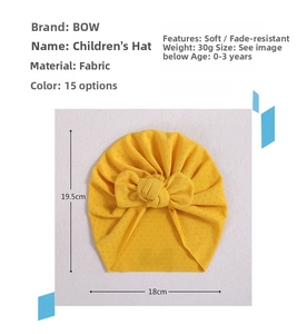 Infant turban hat dimensions 18x19.5cm in ginger yellow with a soft bow detail