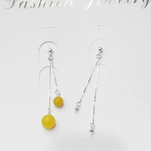 Detail of S925 sterling silver drop earrings featuring double box chains and yellow beads