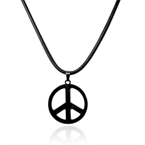 Detail of a black metal peace symbol pendant on a braided rope chain necklace