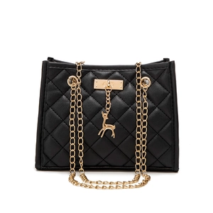 Classic black quilted crossbody bag with gold chain strap and decorative deer charm