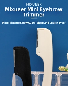 Mini eyebrow razor with safety macro guard and ergonomic handle in black and white