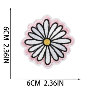 Close-up of a 6cm daisy embroidered patch with colorful petals and size markings