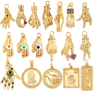 Detailed grid of gold-plated Hamsa and Evil Eye charms with colorful zircon inlays