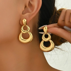 Chic triple-layered gold metal hollow hoop earrings for women in a vintage bold design