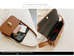 Detail view of brown leather shoulder bag interior compartments with gold lock buckle