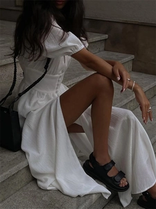 White puff sleeve midi dress with button waist and side slit in French minimalist style