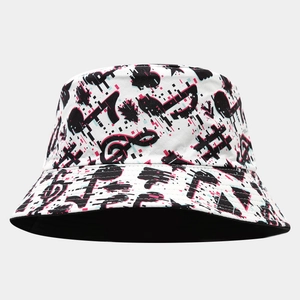 Detailed close-up of glitch art music note print on the crown of a stylish bucket hat