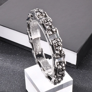 Detail of vintage silver punk skull bicycle chain bracelet for men in stainless steel