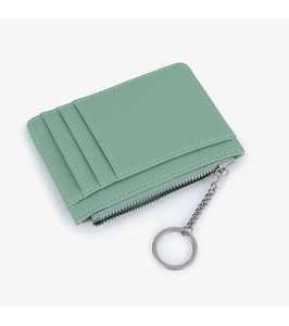 Detail of mint green cross-grain leather card holder with three card slots and zipper pocket