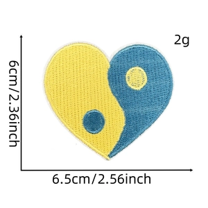 Detail showing dimensions of heart-shaped yin yang embroidery patch in blue and yellow