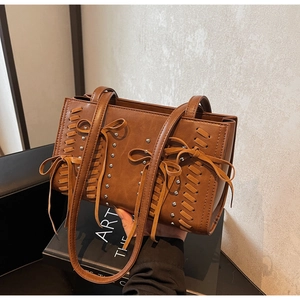 Chic brown PU leather handbag with decorative bows and silver studs for women