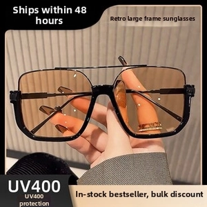 Detail of retro oversized sunglasses with UV400 anti-blue light orange lenses
