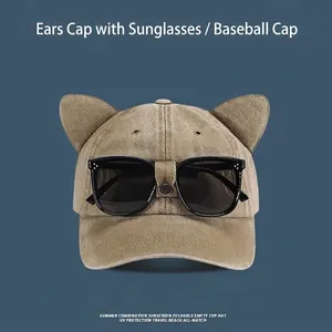 Detail of khaki cotton baseball cap with decorative cat ears and integrated sunglasses