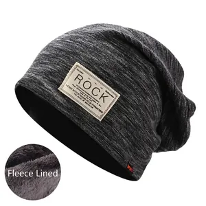 Detail view of slouchy beanie with warm fleece lining and stylish square patch