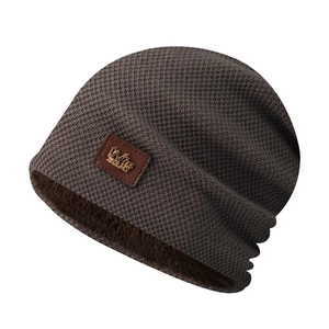 Detail of winter knit hat featuring brown waffle texture and warm plush faux fur lining