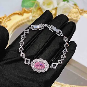 Luxury silver bracelet with oval pink zircon center and shimmering micro-set diamond accents