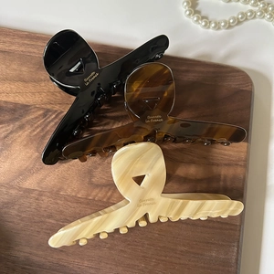 Elegant large French acetate hair claws in black, tortoiseshell, and beige for thick hair