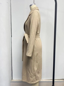 Side view of beige long wool coat with lapel collar and matching waist tie
