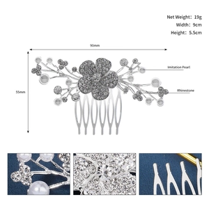 Detailed view of silver bridal hair comb with rhinestone flowers and imitation pearls