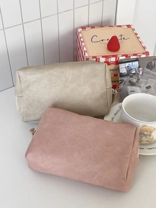 Detail showing the crinkled texture and metal zipper of the waterproof PU cosmetic bags
