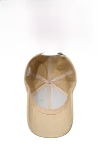 Detail view of khaki baseball cap interior showing sweatband and reinforced stitching
