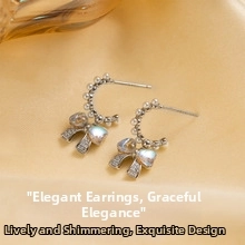 Close-up of sparkling bow knot earrings with pearls on yellow silk background