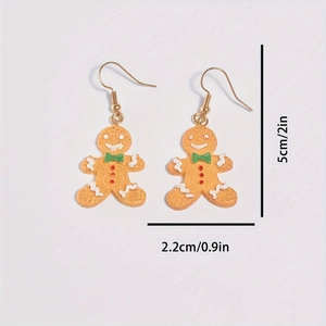 Cute gingerbread man Christmas earrings with size dimensions on white background