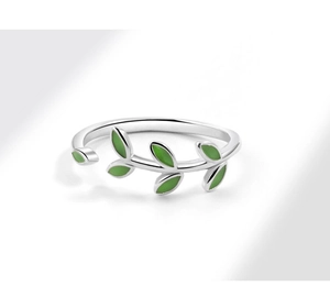 Detailed macro view of the silver adjustable ring with green enamel vine leaf patterns