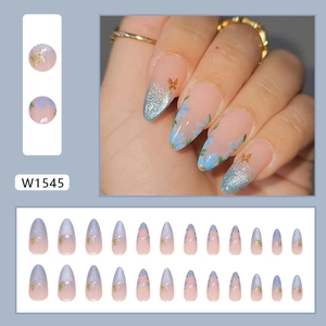 Blue cat eye press-on nails almond shape with floral design and golden butterfly charms