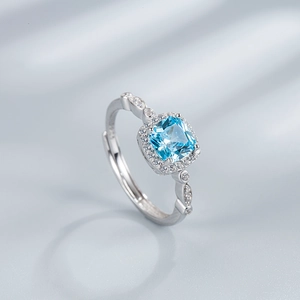925 sterling silver ring with square blue gemstone and sparkling diamond halo