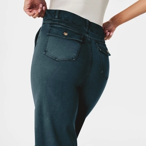 Detail view of high waist dark green cargo pants with back flap pockets and seam stitching