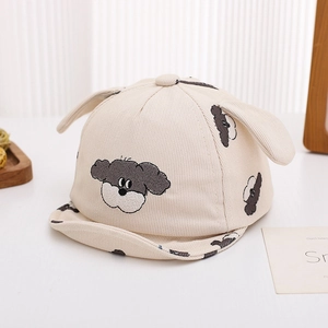 Close-up of baby corduroy cap showing high-quality puppy embroidery and 3D ear details