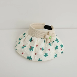 Detailed view of cream sun visor with floral quilting and 3D flower m-logo detail