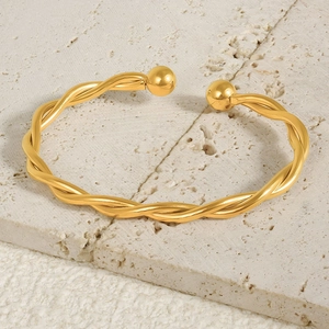 Elegant 18k gold plated stainless steel twisted cuff bracelet for women on stone base