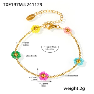 Detail of colorful flower glass bead bracelet with stainless steel gold chain links