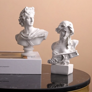 Nordic white resin David and Lyra female bust sculptures on black marble table