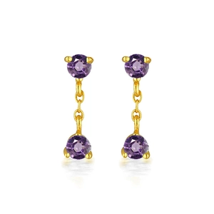 Detailed view of elegant gold-tone drop earrings with two round-cut purple amethyst stones