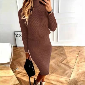 Detail view of brown ribbed knit texture on high neck sweater and matching pencil skirt