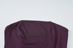 Close-up of the elegant purple strapless neckline with ruffled details on a long dress