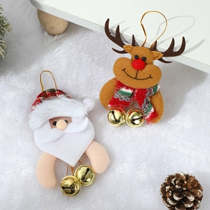 Christmas plush Santa and Reindeer hanging ornaments with bells on white faux fur background