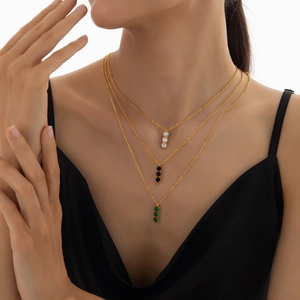 Three-layered gold titanium steel necklace with green black and clear zircon pendants