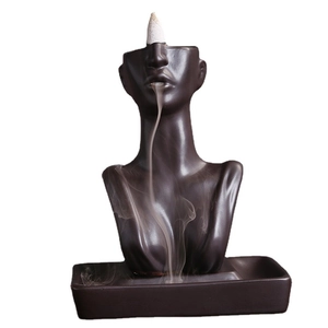 Brown ceramic woman statue backflow incense burner with smoke flowing from mouth