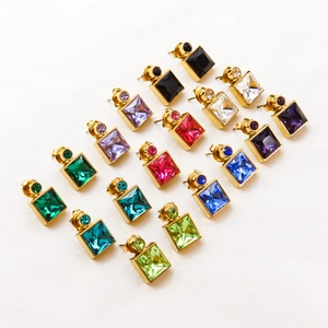 Square titanium steel earrings with zircon inlay in various colors on white fabric