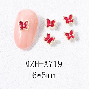 Détail de décoration d'ongles papillon rouge 6x5mm avec bord doré pour l'art des ongles