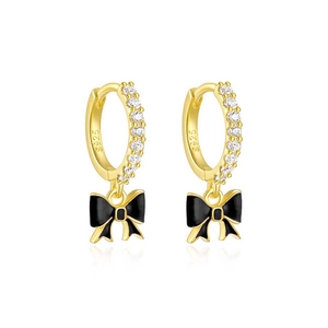 Macro view of S925 silver gold-plated hoop earrings with black enamel bow and zircons