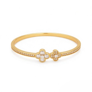 Elegant 18K gold clover bangle with sparkling cubic zirconia flower shaped clusters