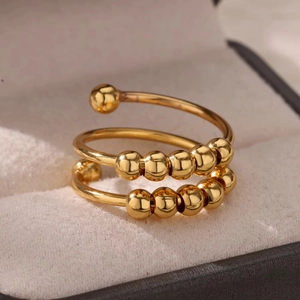 18k gold plated spiral bead anxiety relief ring presented in a premium jewelry gift box